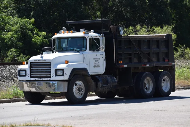 dump truck, truck, road, dumper, delivery, construction equipment, transport, trucking, industry, hard hat area, contractor, white car, heavy load, payload, hard work, travel, tools, escavator, dump truck, dump truck, dump truck, dump truck, dump truck. Dumpster Rental Equipment Checklist for Dispatch Readiness