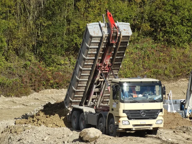 dump truck, truck, gravel plant, unloading point, earth, earth material, unload, construction site, building, dump truck, dump truck, dump truck, dump truck, dump truck, truck. Dumpster rental delivery routes: dispatch principles